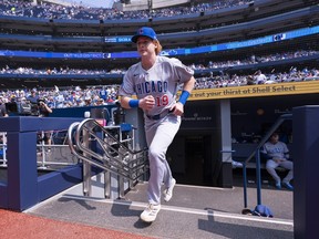 Owen Caissie takes the field for warm-ups.