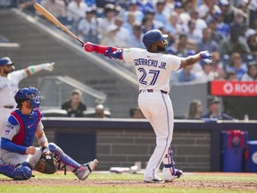 Vladimir Guerrero Jr. watches his home run.