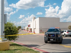Police secure a Target parking lot.