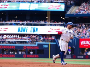 Alejandro Kirk rounds the bases after hitting a home run.