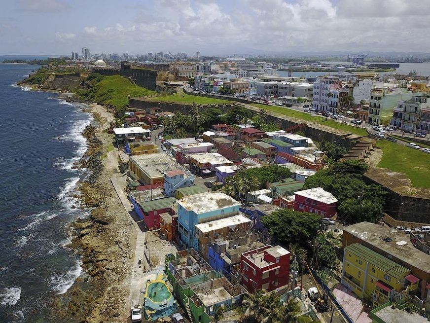 FILE - An aerial view of the seaside neighborhood of La Perla, in San Juan, Puerto Rico, is seen on Aug. 25, 2017.