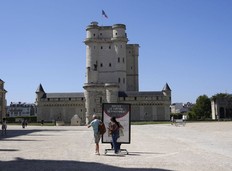 People arrive to visit the Chateau de Vincennes, a massive fortress just east of Paris, Tuesday, Aug. 12, 2025.
