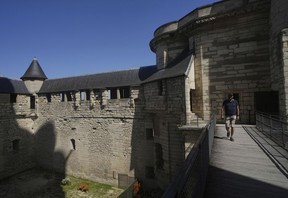 A man tours the Chateau de Vincennes
