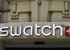 The logo of Swiss watchmaker "Swatch" is pictured on the Champs Elysees Avenue in Paris, France, Wednesday, Sept. 20, 2017.