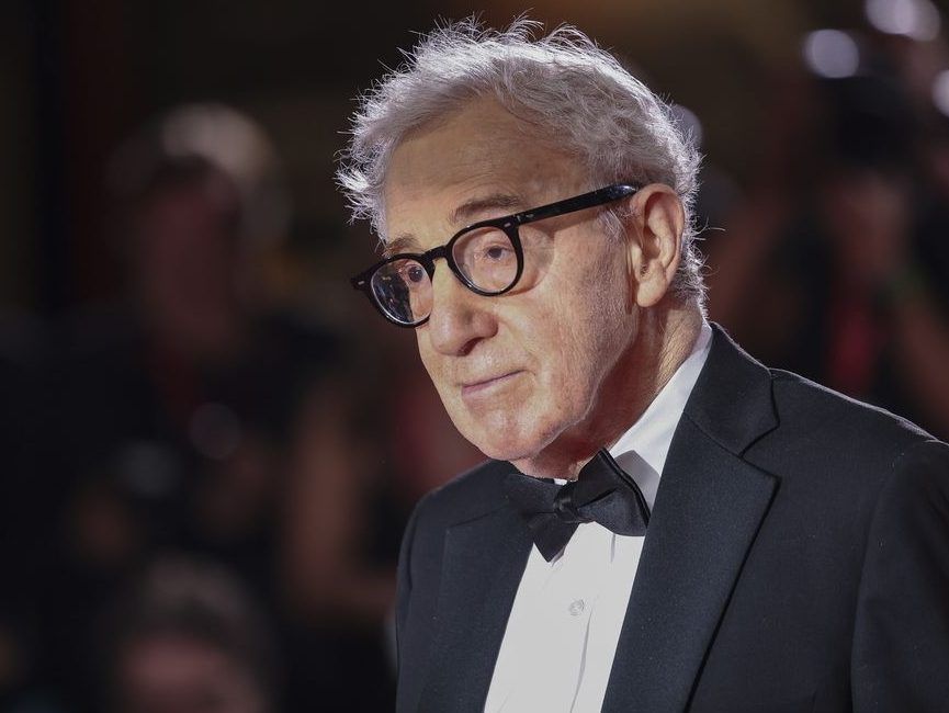 FILE - Director Woody Allen poses for photographers upon arrival for the premiere of the film "Coup de Chance" during the 80th edition of the Venice Film Festival in Venice, Italy, Sept. 4, 2023.