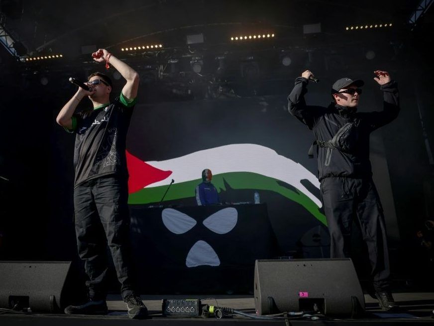 Northern Ireland hip-hop trio Kneecap perform on stage at the Rock en Seine music festival near Paris on August 24, 2025