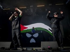 Northern Ireland hip-hop trio Kneecap perform on stage at the Rock en Seine music festival near Paris on August 24, 2025