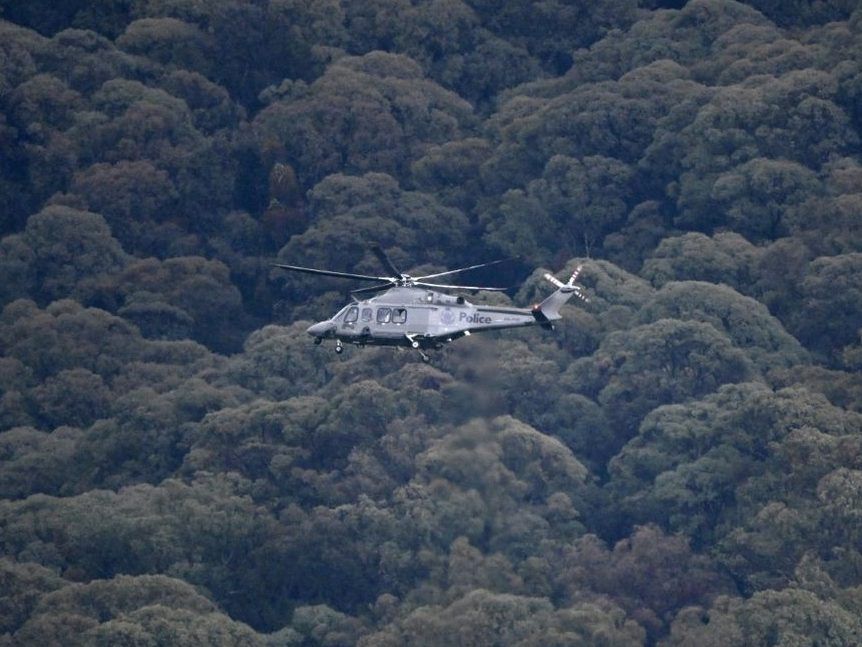 Australian police are searching for heavily-armed gunman Dezi Freeman who is on the run after allegedly killing two officers