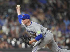 Louis Varland throws a pitch.