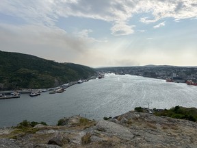 Smoke from a nearby wildfire is visible from Signal Hill in St. John's.