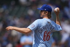 Actor Hayden Christensen throws out a ceremonial first pitch before a baseball game between the Pittsburgh Pirates and Chicago Cubs, Friday, Aug. 15, 2025, in Chicago.