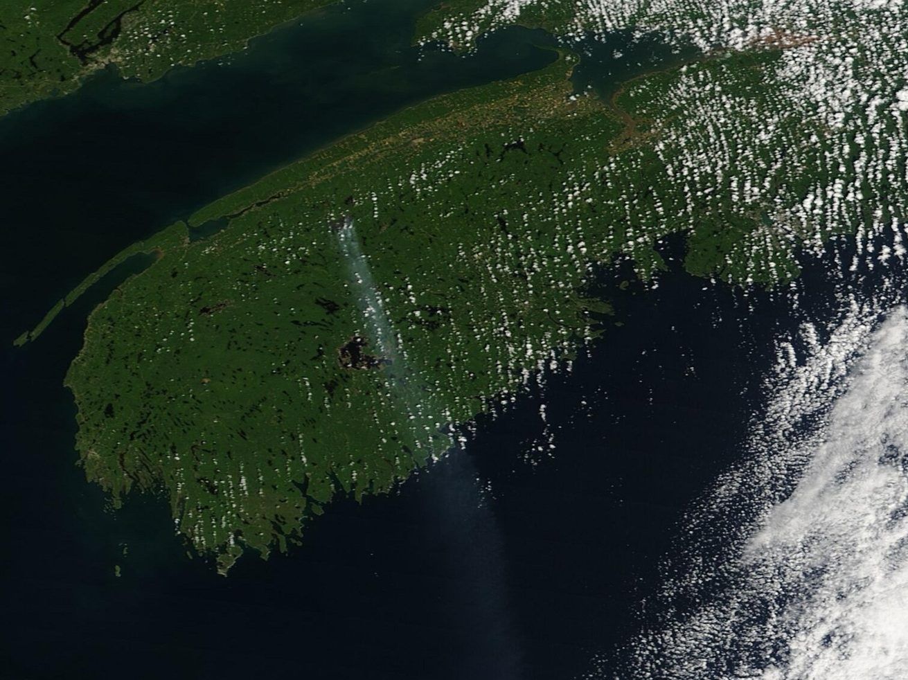 Satellite image with a trail of smoke from the Long Lake wildfire in Nova Scotia.
