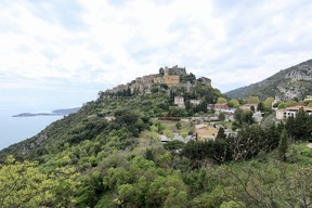 The picturesque village of Èze perched on a cliffside above the Mediterranean Sea.