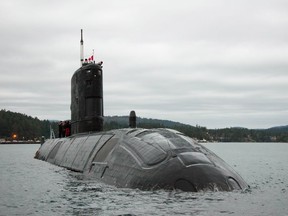 The submarine is partially submerged.