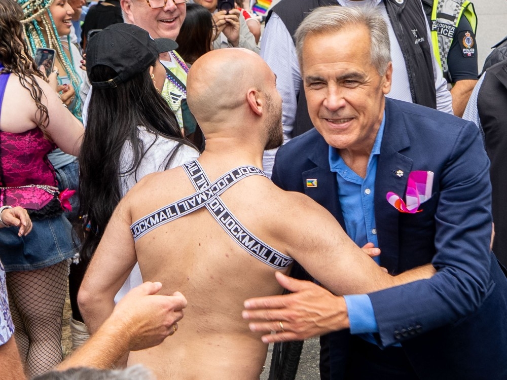 Mark Carney mocked for hugging man in thong at Pride parade | Toronto Sun
