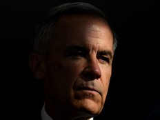Mark Carney in shadow with light on have of his face