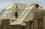 Framers work on a new home build in Aurora, Ont. Wednesday May 14, 2025.