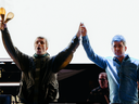 Oasis singer and guitarist, Liam and Noel Gallagher. walk onto their Toronto stage Sunday night to begin the first of two reunion shows at Rogers Stadium.