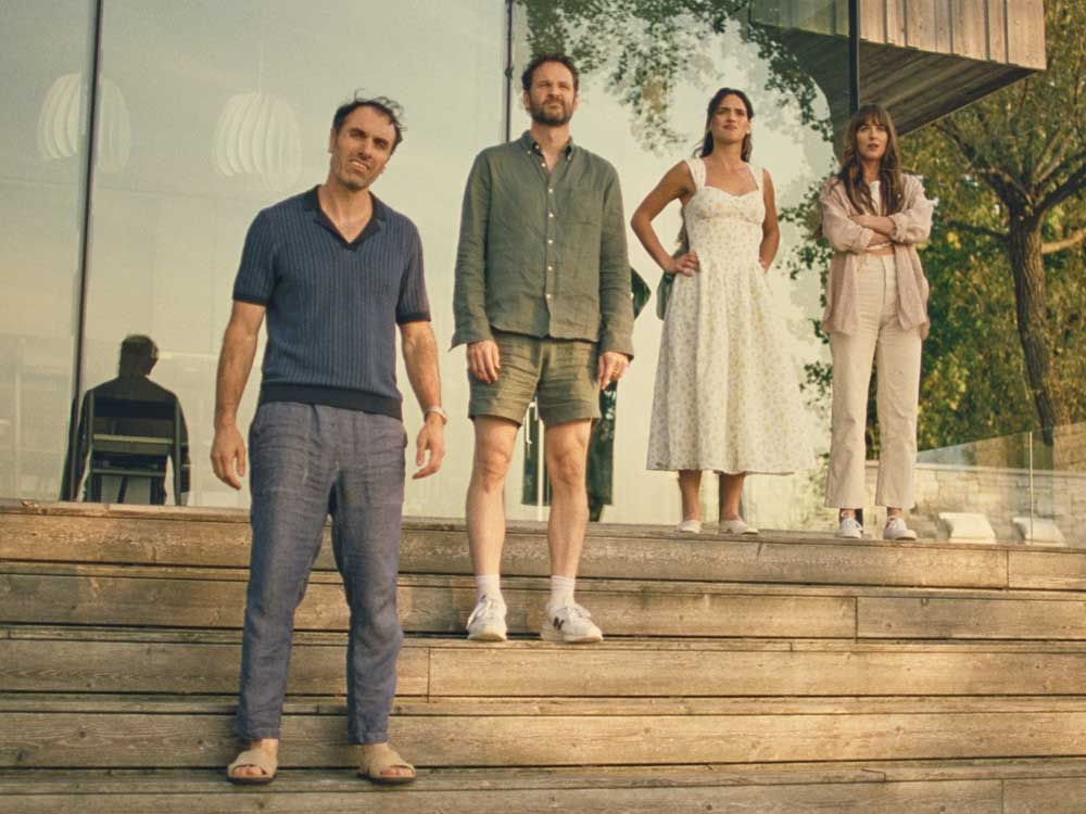 This image released by Neon shows, from left, Michael Angelo Covino, Kyle Marvin, Adria Arjona, and Dakota Johnson in a scene from "Splitsville."