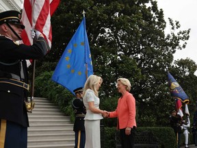 European Commission President Ursula von der Leyen (right) is greeted by U.S. Chief of Protocol Monica Crowley as she arrives at the White House for a meeting with U.S. President Donald Trump and Ukrainian President Volodymyr Zelensky on Aug. 18, 2025 in Washington, D.C.