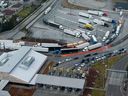 Tractor trailers entering the U.S. from Canada at the Pacific Highway Border Crossing in Blaine, Washington, on Monday, March 3, 2025.