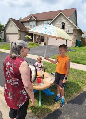 Ethan chatting with one of his neighbours.