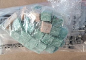Jesse Schnarr, 33, of Hamilton, faces charges after a stash of drugs, cash and a loaded handgun were allegedly seized in Hamilton on Thursday, July 31, 2025.
