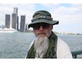 Dan Livers, of Michigan, who kayaked across the Detroit River on Aug. 5, 2025, is shown on the Windsor waterfront with Detroit in the background on Aug. 21, 2025.