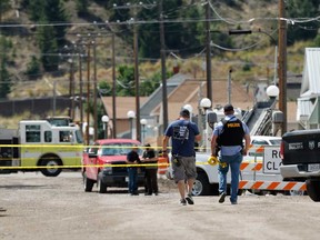 Law enforcement personnel respond to a reported shooting in Anaconda, Mont., Friday, Aug. 1, 2025.