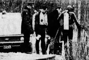 GRUESOME: Cops at the scene where two bodies had been discovered in November 1969. POSTMEDIA