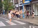 Pro-Palestinian protesters rally at the corner of Chester and Danforth Aves., near the Chester TTC station, on Tuesday, Aug. 12, 2025, during a so-called