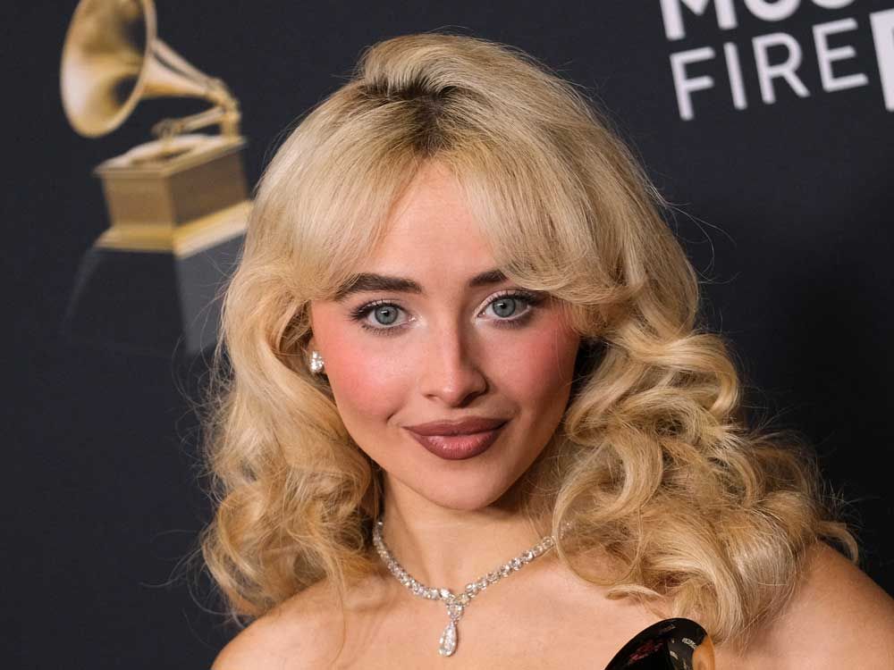 Sabrina Carpenter poses with the Best Pop Vocal Album for "Short n' Sweet" and Best Pop Solo Performance awards in the press room during the 67th Annual Grammy Awards at the Crypto.com Arena in Los Angeles on Feb. 2, 2025.