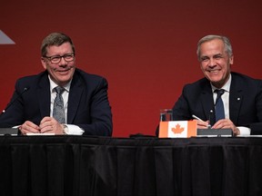 Saskatchewan Premier Scott Moe and Prime Minister Mark Carney.