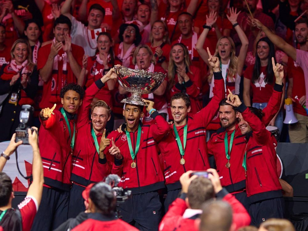 Canadian players and fans celebrate after Canada won the Davis Cup on Nov. 27, 2022 in Malaga, Spain.