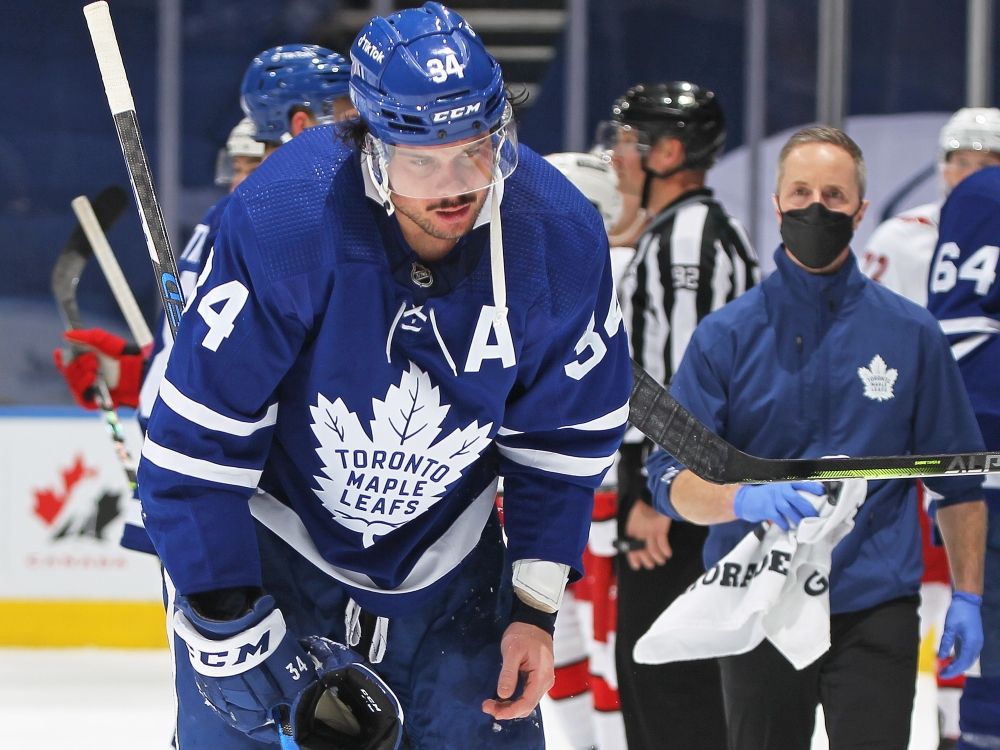 Auston Matthews of the Toronto Maple Leafs is injured late in the game against the Carolina Hurricanes during a game in 2022.