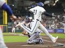 Houston Astros' Yordan Alvarez scores on an RBI single hit by Carlos Correa against the Texas Rangers.