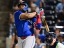 Vladimir Guerrero Jr. of the Toronto Blue Jays hits an RBI single in the second inning against the Tampa Bay Rays.