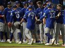 Toronto Blue Jays players celebrate after defeating the Tampa Bay Rays on Monday night.