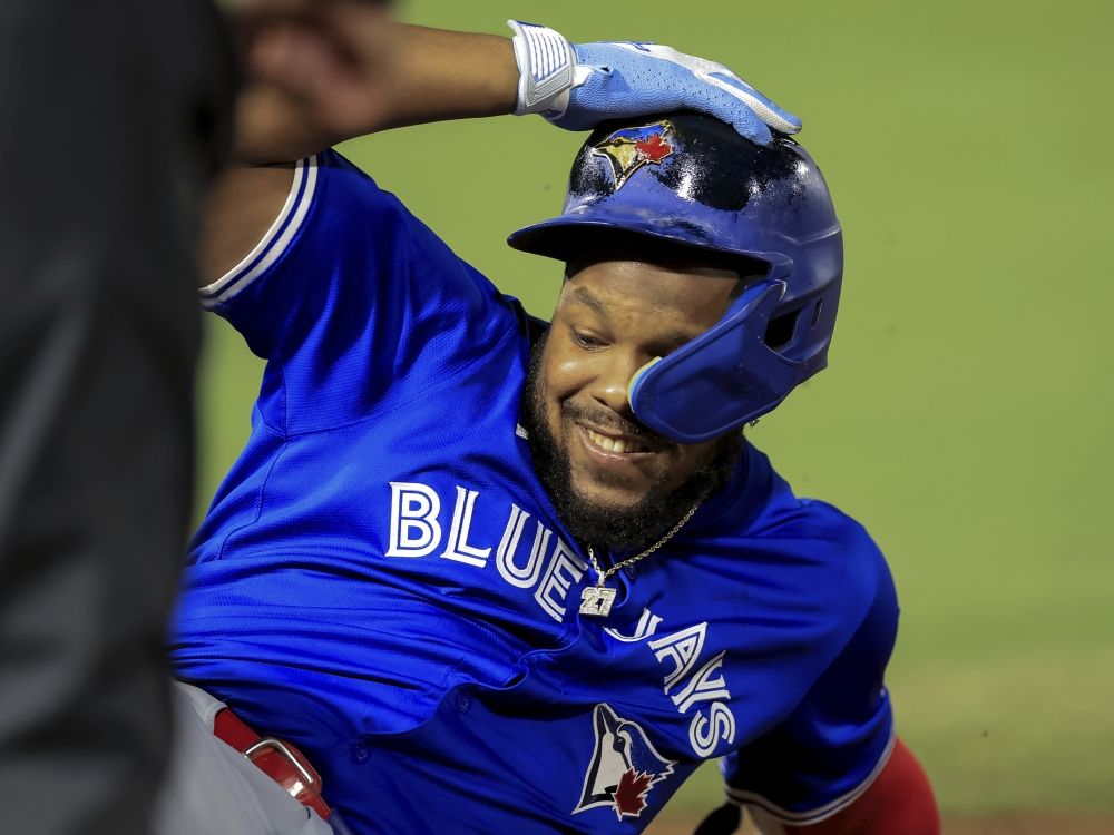 Toronto Blue Jays' Vladimir Guerrero Jr. slides back into first base against the Tampa Bay Rays.