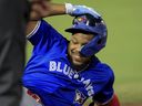 Toronto Blue Jays' Vladimir Guerrero Jr. slides back into first base against the Tampa Bay Rays.