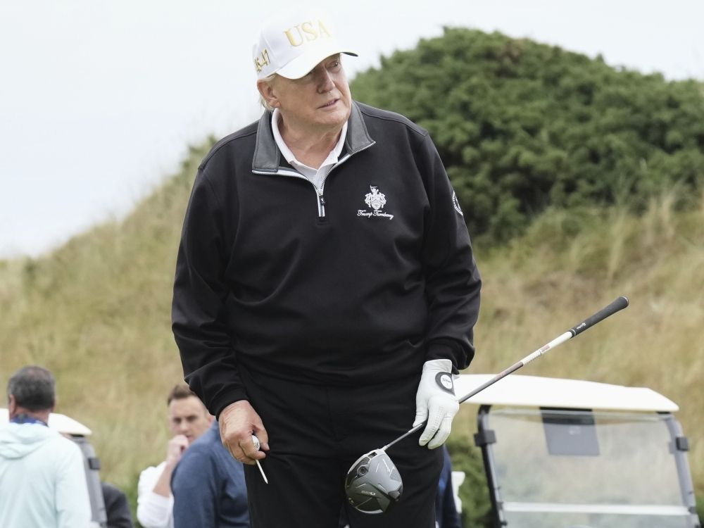 U.S. President Donald Trump hits a ball off the first tee to officially open the New Course at Trump International Golf Links in Balmedie, Aberdeenshire.