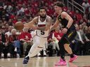 Houston Rockets' Fred VanVleet drives to the basket as Golden State Warriors' Brandin Podziemski defends during a playoff game earlier this year.