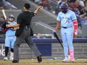 Vladimir Guerrero Jr of the Toronto Blue Jays is ejected from the game by umpire Gabe Morales after being called out on strikes against the Boston Red Sox.