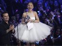 Christian Breslauer, left, and Ariana Grande accept the award for video of the year for