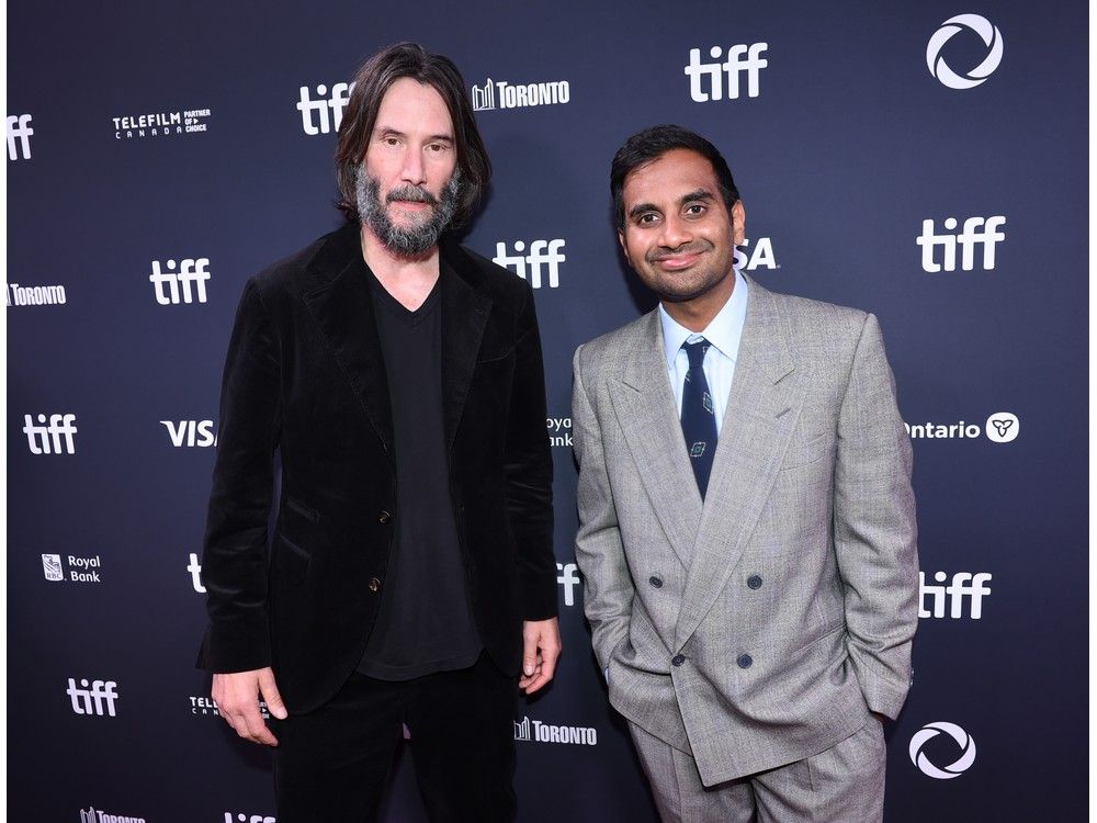 Keanu Reeves, left, and Aziz Ansari attend the "Good Fortune" world premiere at the Toronto International Film Festival on Sept. 6, 2025 in Toronto.