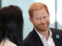 Britain's Prince Harry, Duke of Sussex, reacts as he takes part in a panel discussion on how social action positively impacts mental health, with four young people who are involved with The Diana Award, in central London on September 11, 2025.