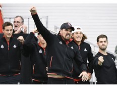 Team Canada captain Frank Dancevic and players react during a Davis Cup qualifying tennis match between Alexis Galarneau, of Canada, and Marton Fucsovics, of Hungary, in Montreal on Sunday, February 2, 2025.