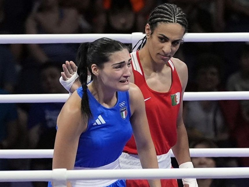 FILE - Algeria's Imane Khelif, right, looks at Italy's Angela Carini, following their women's 66kg preliminary boxing match at the 2024 Summer Olympics, Thursday, Aug. 1, 2024, in Paris, France.