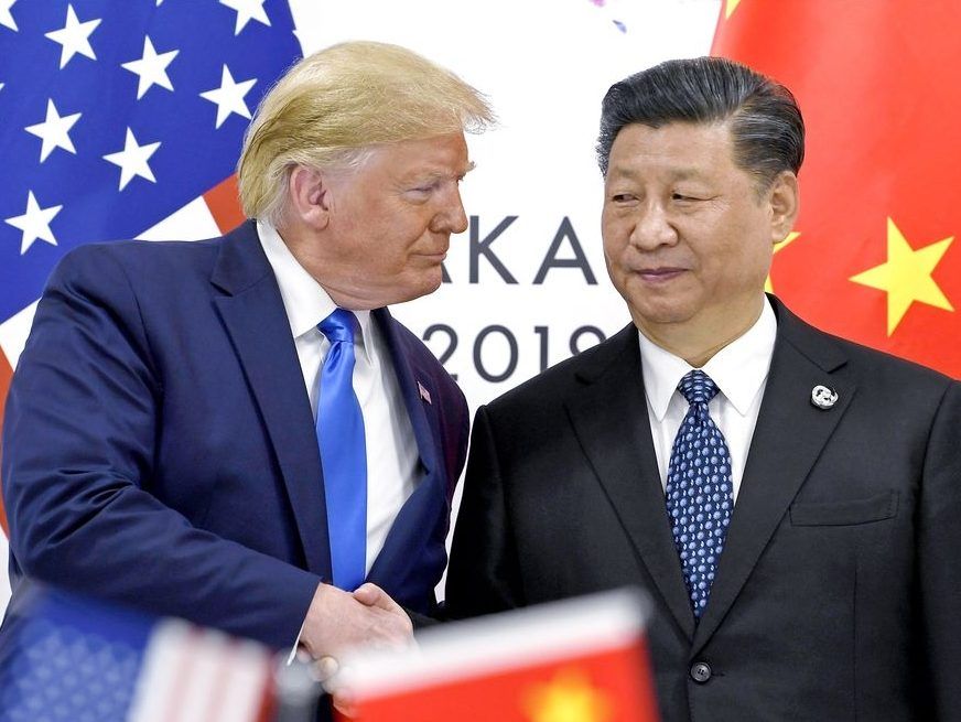 FILE - President Donald Trump, left, shakes hands with China's President Xi Jinping during a meeting on the sidelines of the G-20 summit in Osaka, Japan, June 29, 2019.
