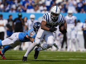 Indianapolis Colts running back Jonathan Taylor (28) breaks away from Tennessee Titans safety Amani Hooker (37) on his way to a touchdown during the second half of an NFL football game Sunday, Sept. 21, 2025, in Nashville, Tenn.